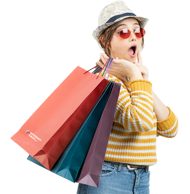 Woman wearing sunglasses holding shopping bags